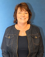 board member with dark hair and a jean jacket