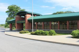 EJR Elementary School brick building with green roof and green plantings out front