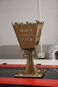3D  Cardboard  trophy that says Duct Boat Race 