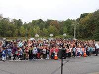 Large group of children wait for the slime to be poured