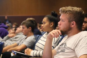 A row of students listen intently to the No Place For Hate speaker