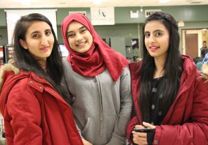 Three high school girls smiling