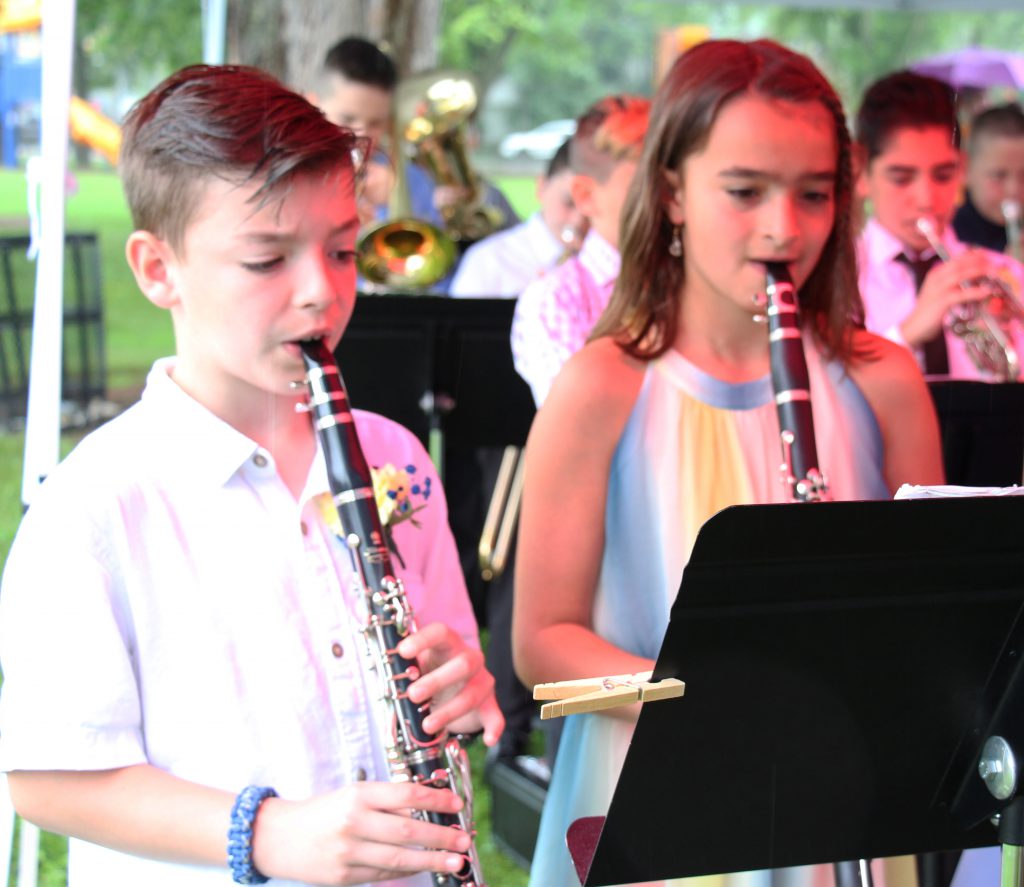 A fifth grade boy and girl play oboes