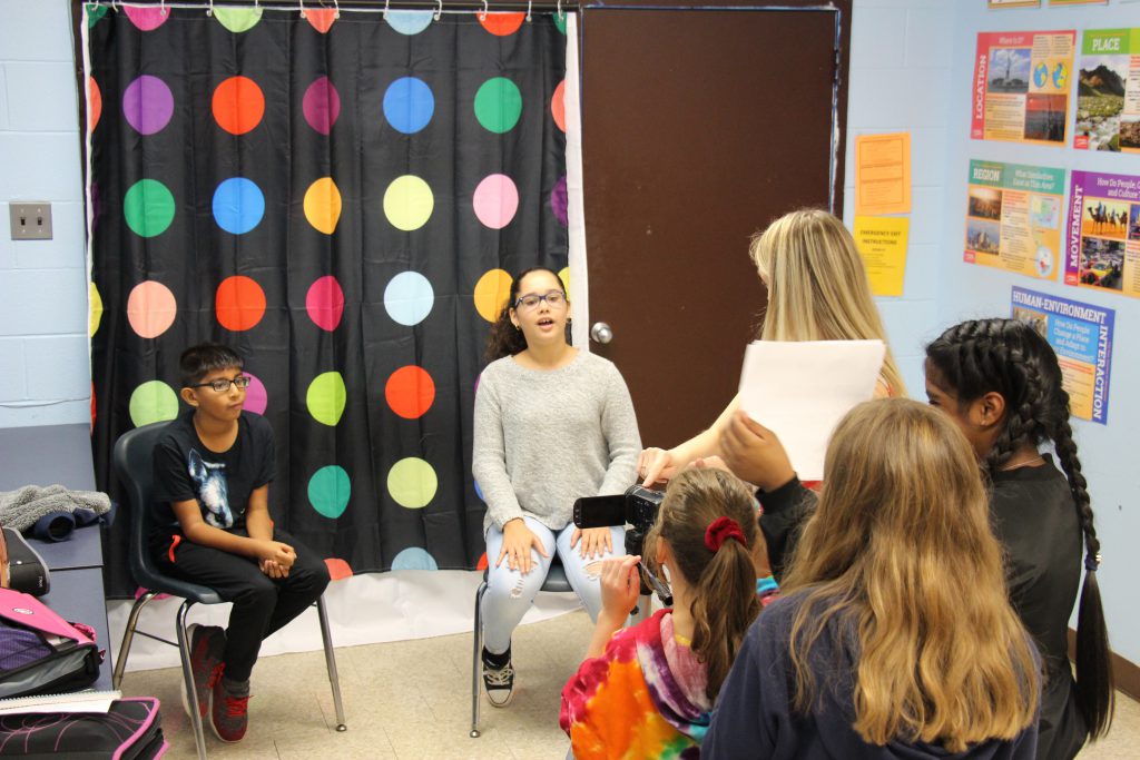 Middle school students video and interview their classmates.