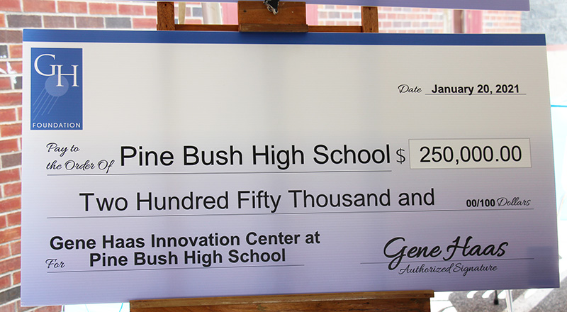 An oversized check made out to Pine Bush High School for $250,000 from the Gene Haas Foundation
