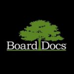 A black square. In the center is a drawing of a green leafy tree. In the center it says Board Docs.