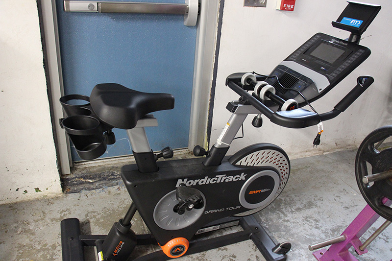 A stationary bike with a computer screen on  the handlebars. It says NordicTrack.