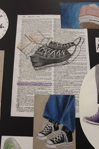 A page from a dictionary with drawings of sneakers on and around it.