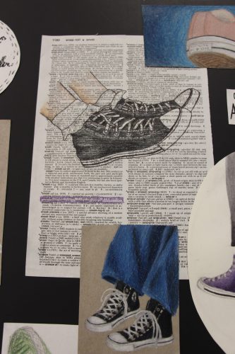 A page from a dictionary with drawings of sneakers on it and around it.