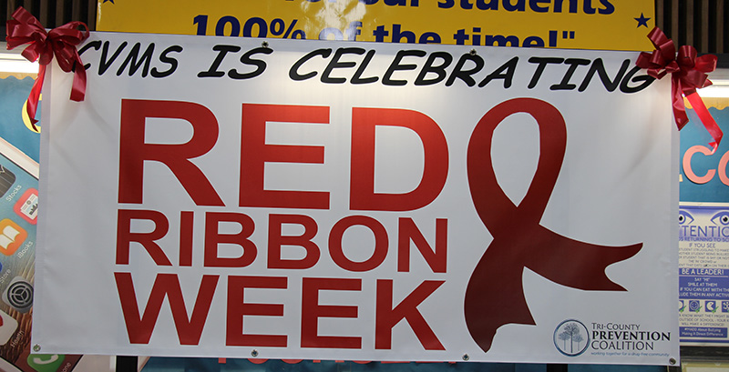 A sign that ways CVMS is celebrating Red Ribbon Week with a large red ribbon next to the words.