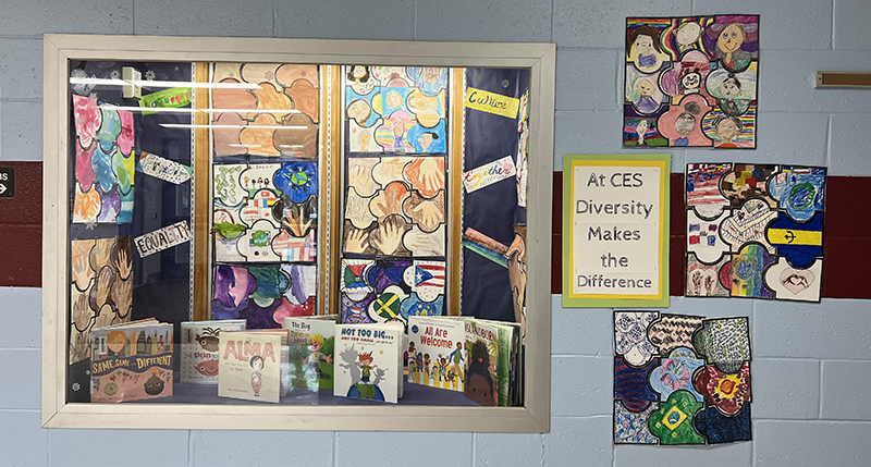 A wall filled with handmade puzzle pieces by elementary students.