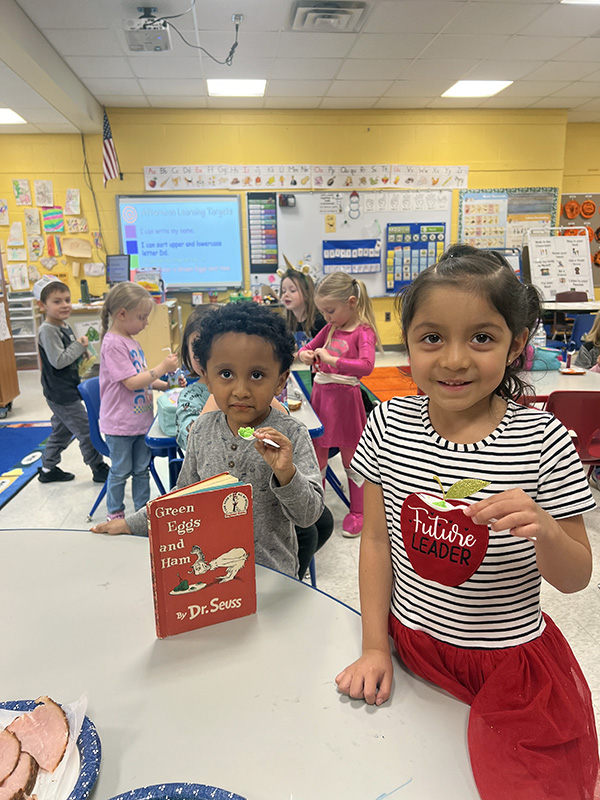 PreK kids eat green scrambled eggs.