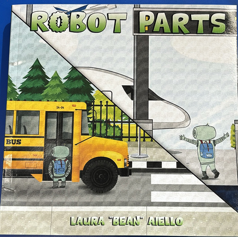 The cover of a book called Robot Parts. There is a school bus on the cover and little robots.