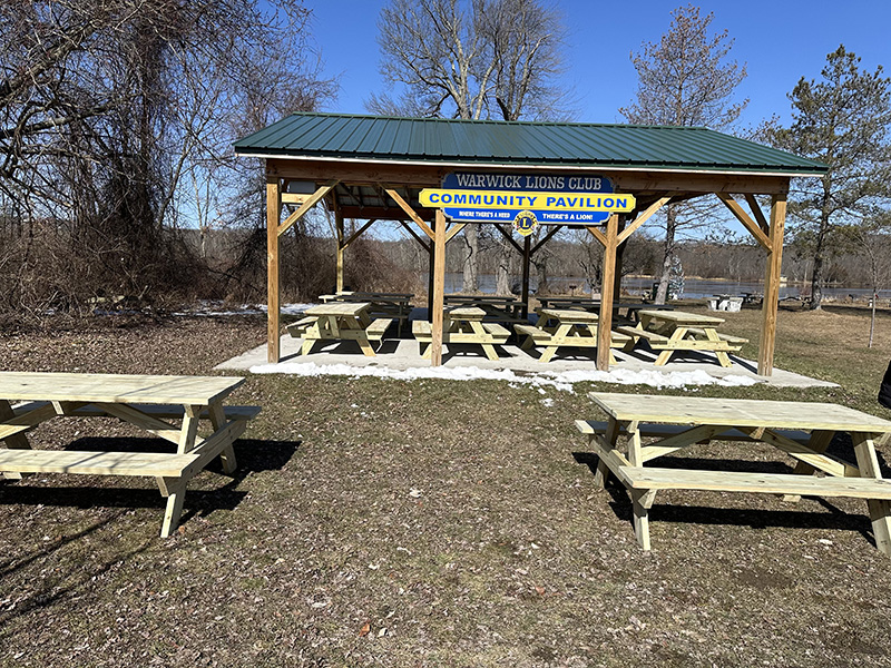 picnic tables outside and some under a pavillion.
