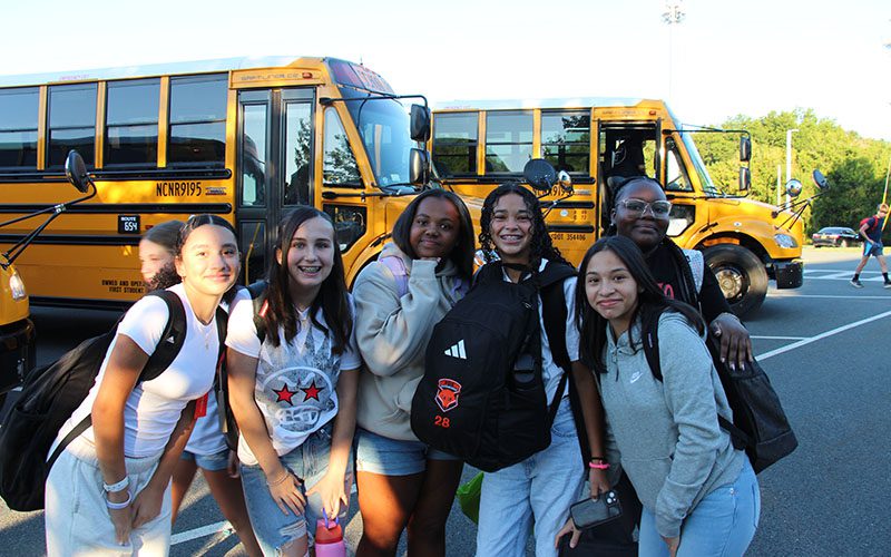 Young woman veteran talks to middle school students about her service