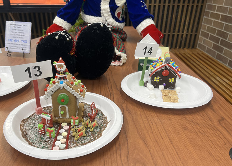 Two gingerbread houses on plates.