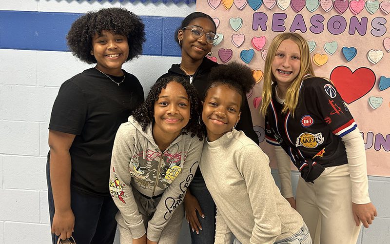 Circleville Middle School student opening his locker and smiling