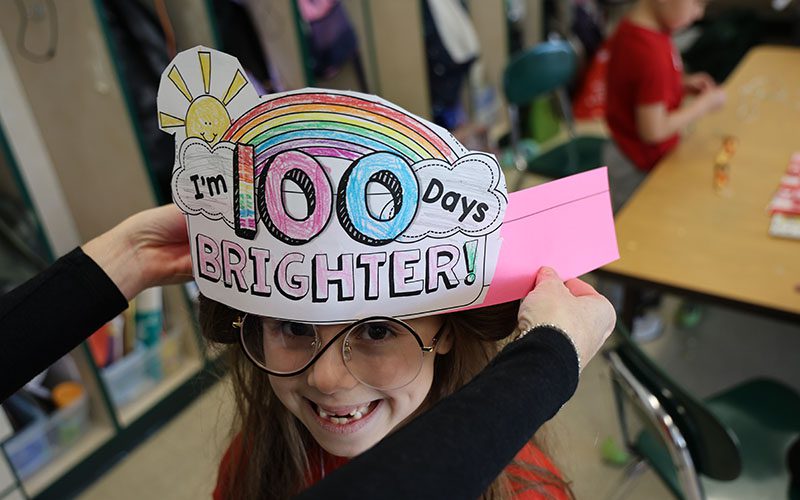Three elementary girls smiling