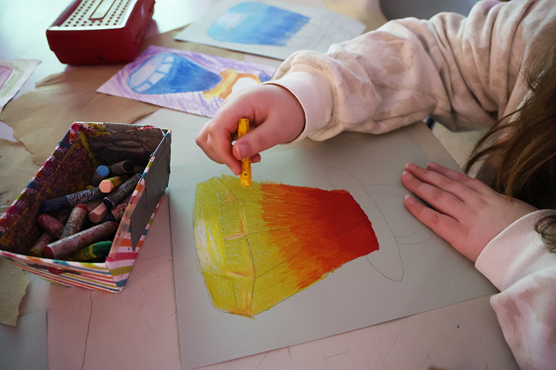 An up-close view of a red, orange and yellow ring pop.