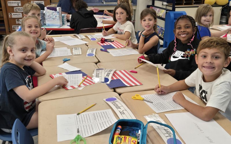 kids sitting at their school desk doing work