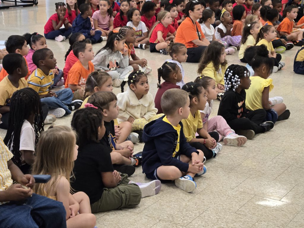 kids sitting on the ground together
