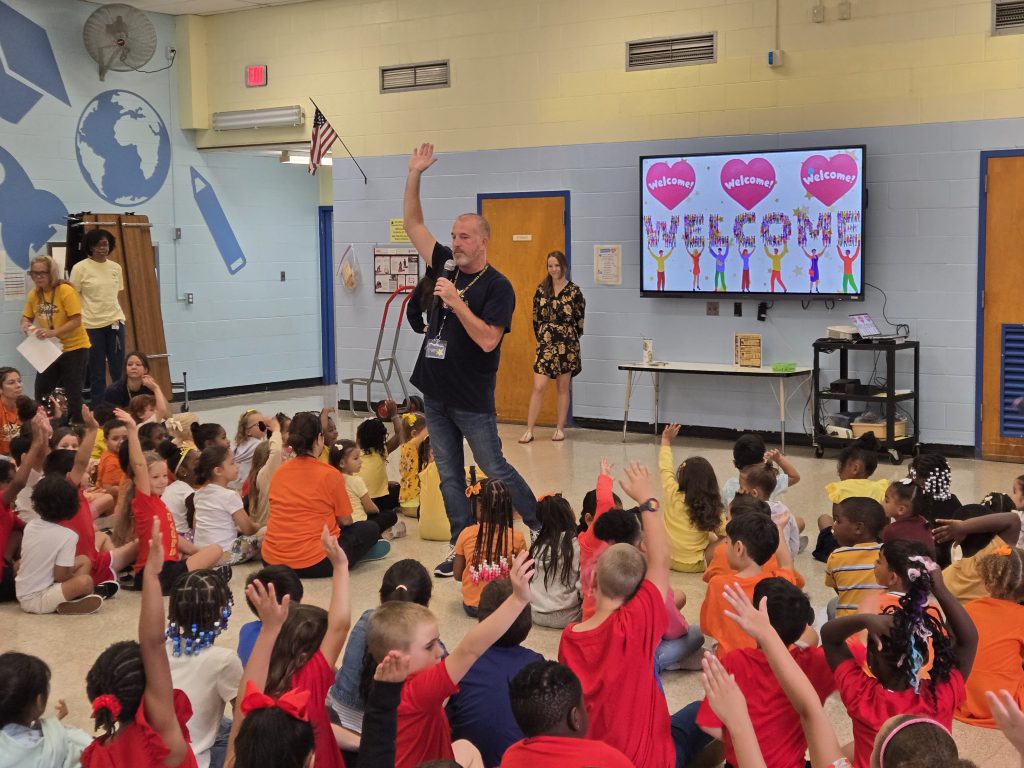 kids gathering for an assembly in their cafeteria