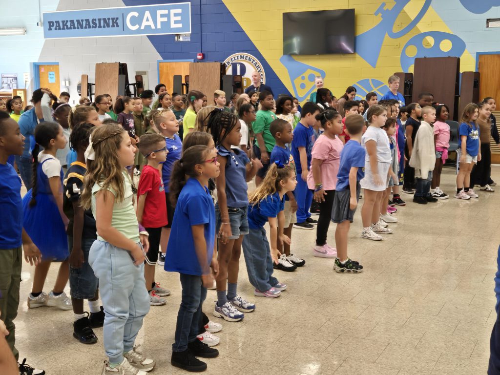 kids standing together in the cafeteria