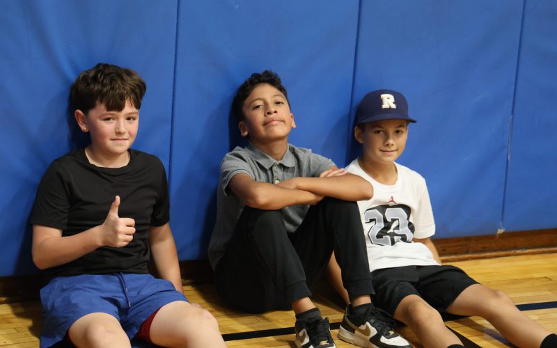 kids sitting on the gym floor