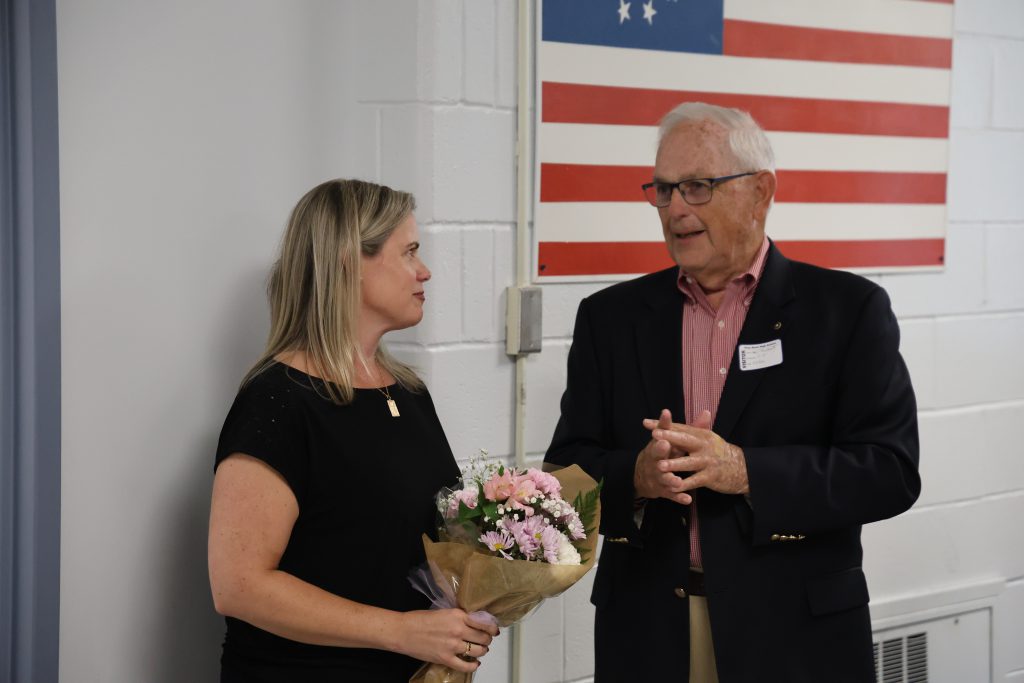 two people standing together having a conversation