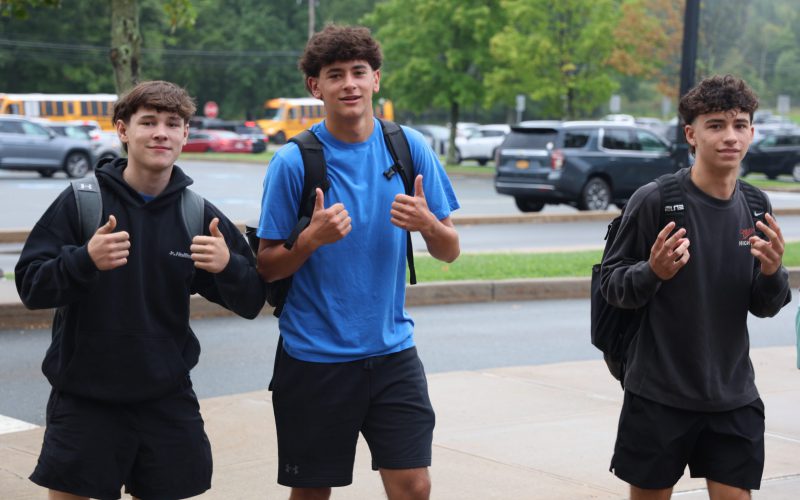 group of teenagers giving a thumbs up
