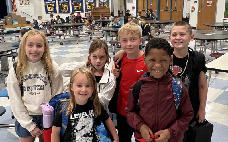 group of kids smiling for a picture