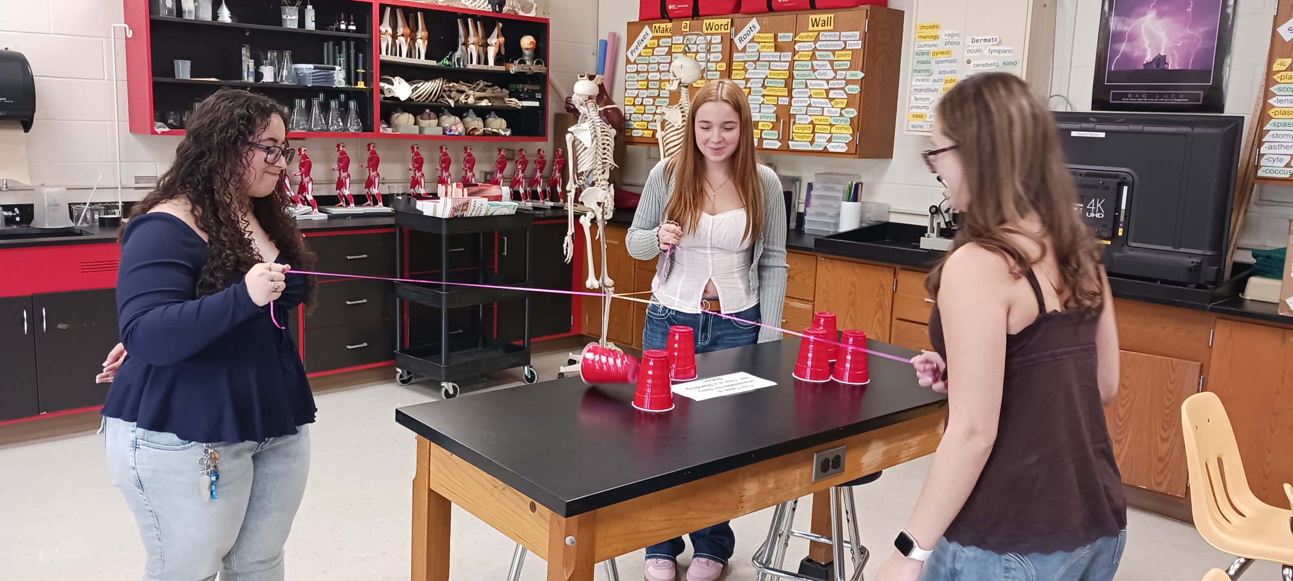 kids doing a science experiment in class