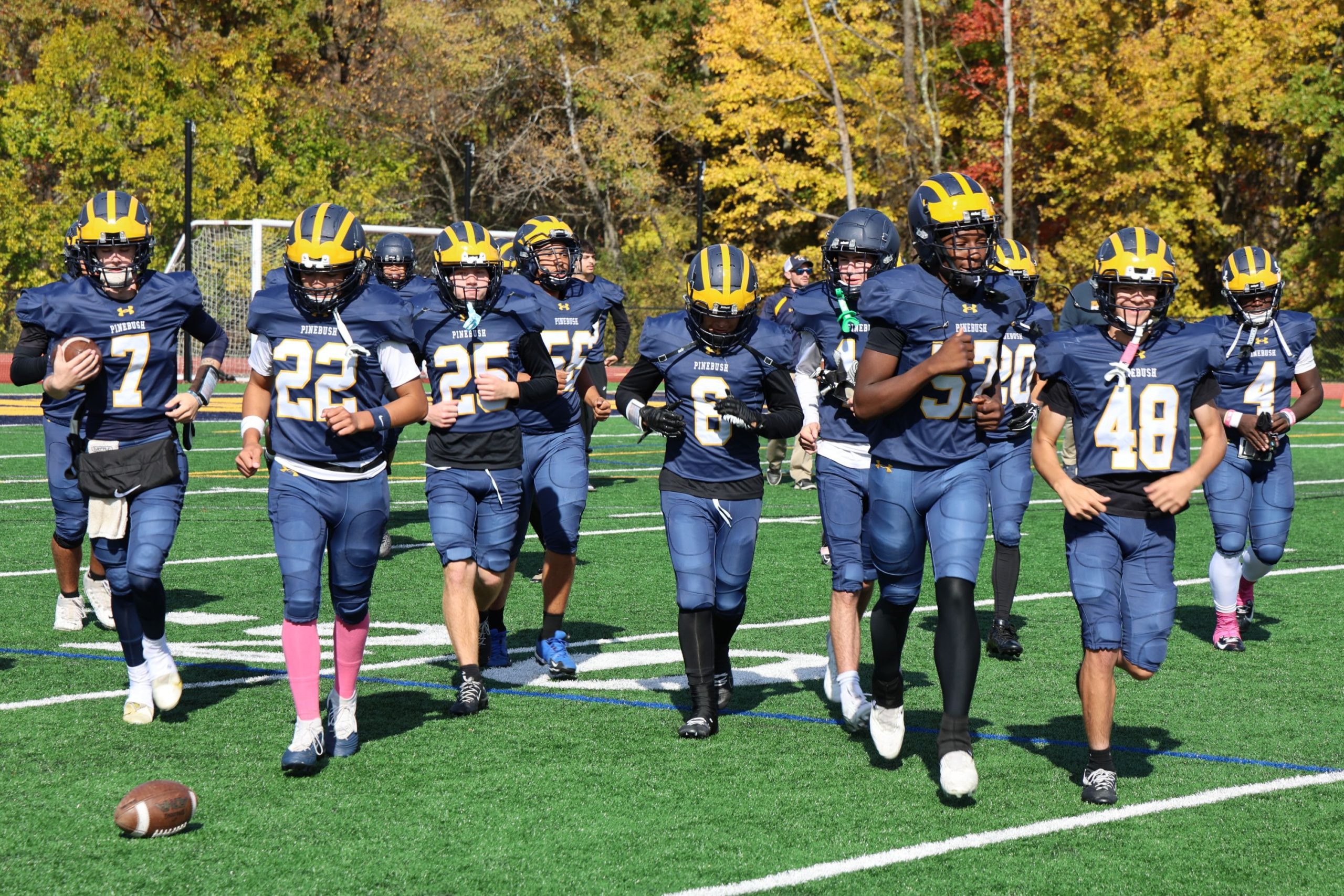 football players running off the field