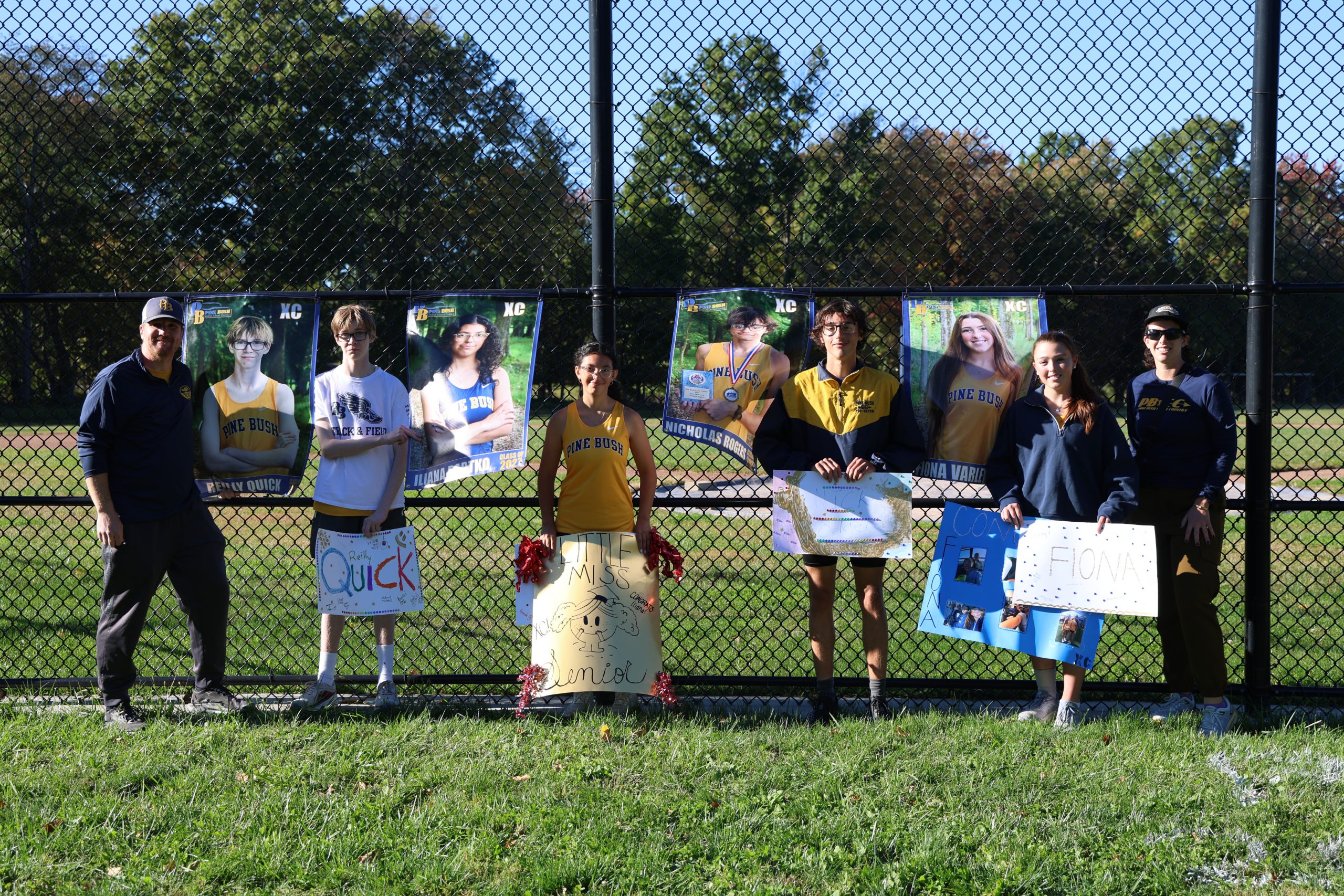 kids standing together for photo with their coaches