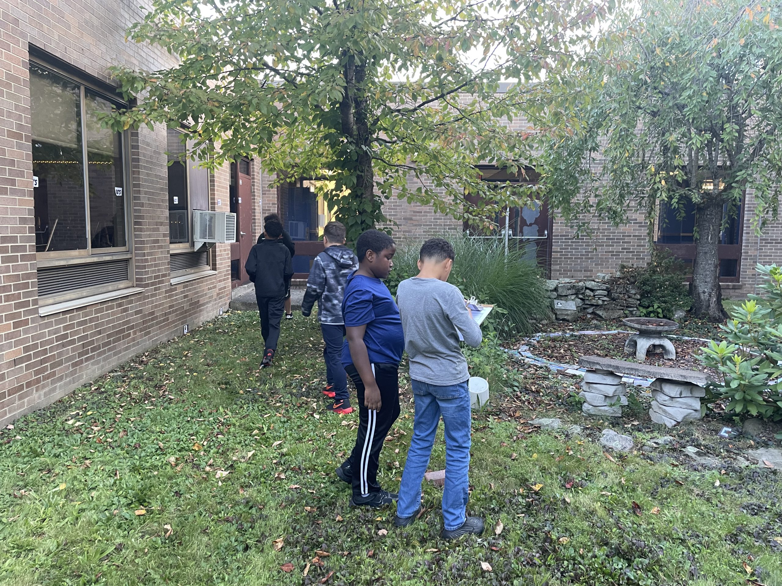 kids doing a project outside of their classroom