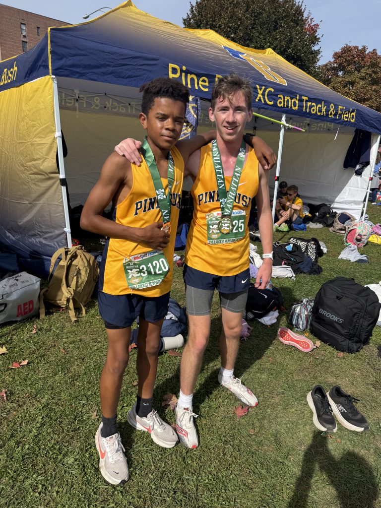 two cross country players standing together