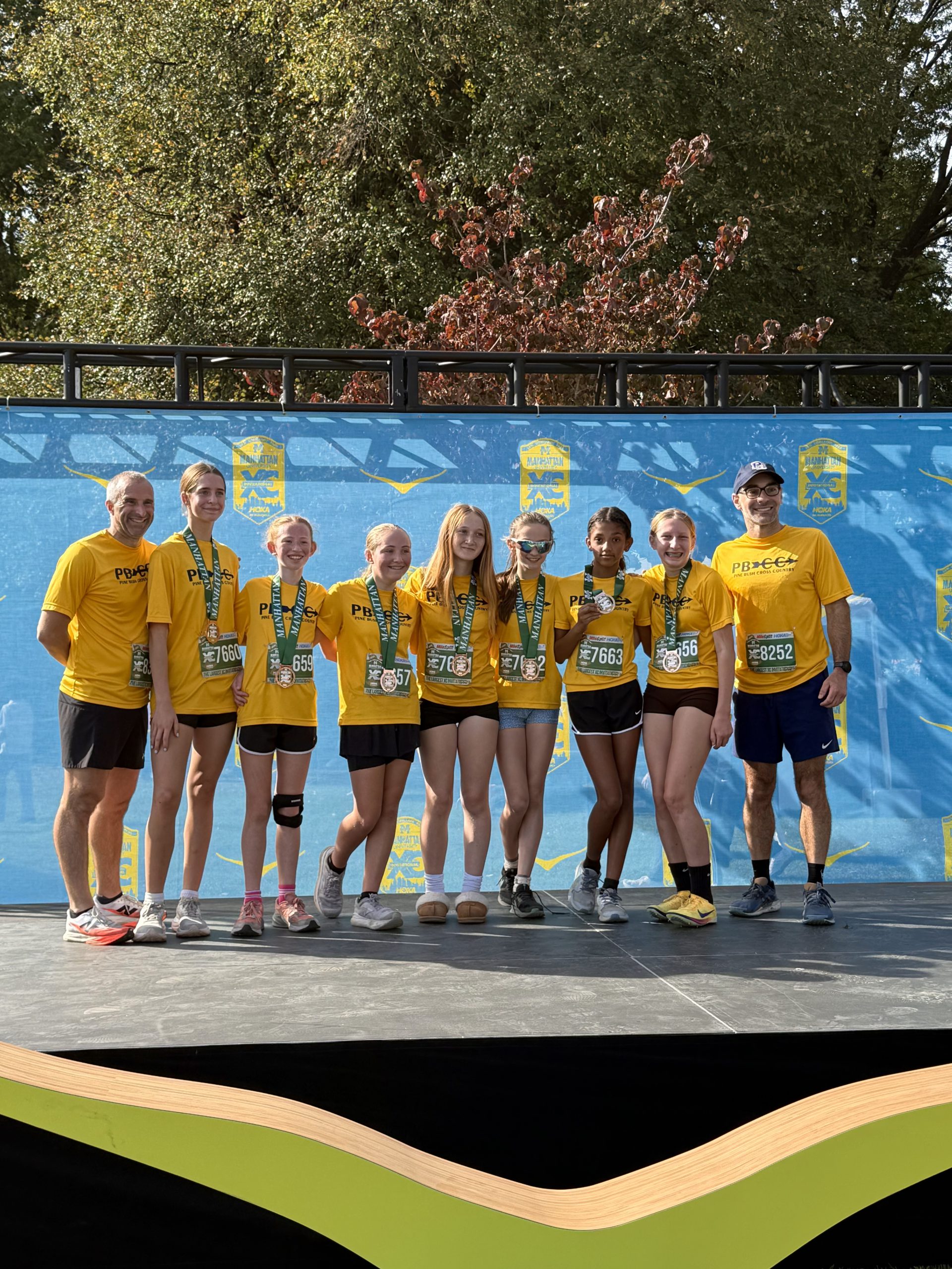 cross country team standing together for picture