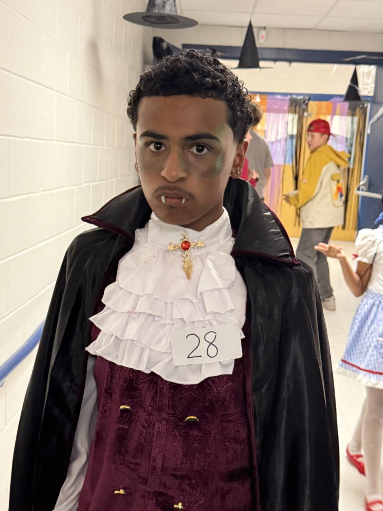 student wearing a vampire costume for halloween