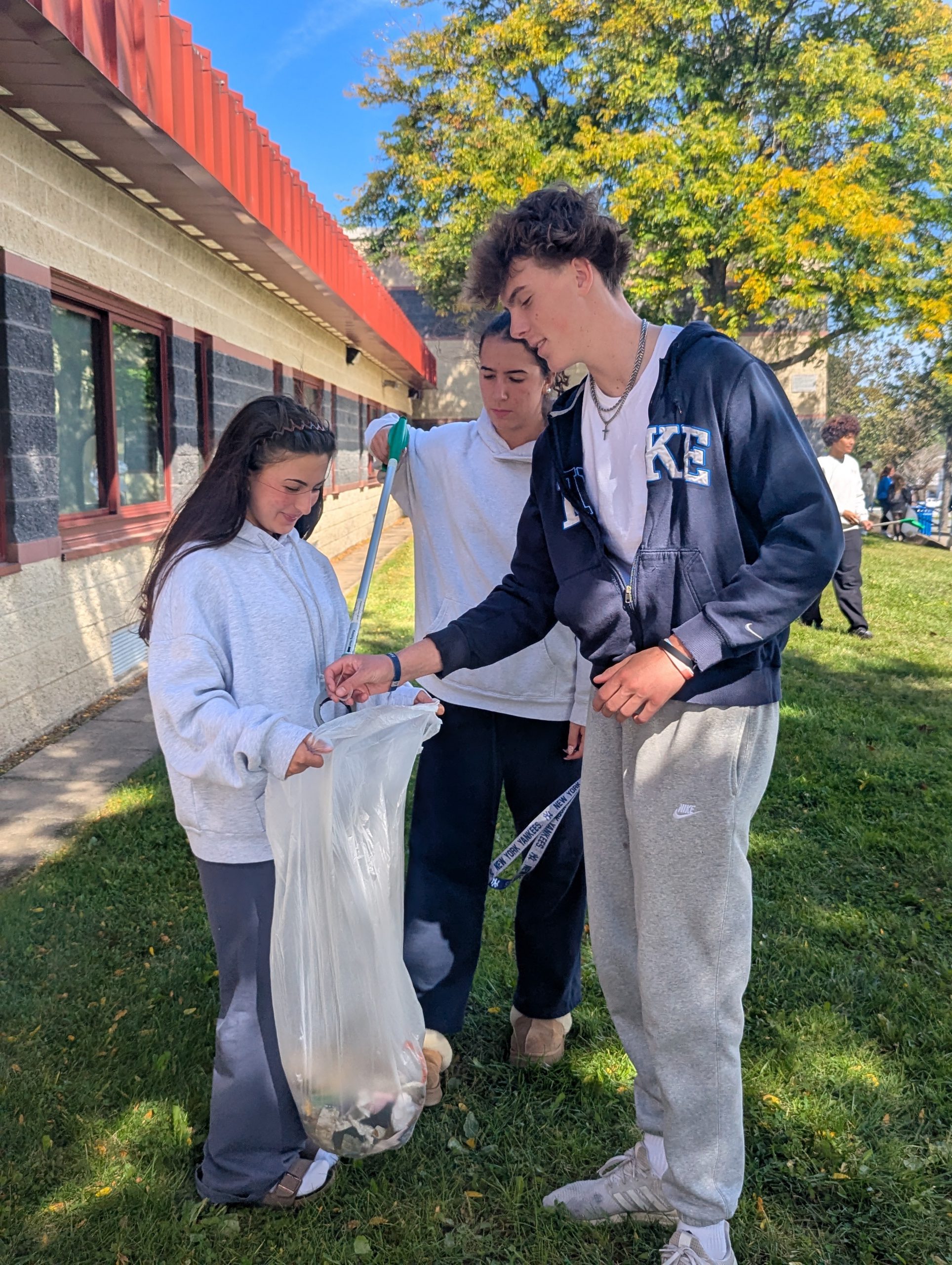 kids picking up garbage